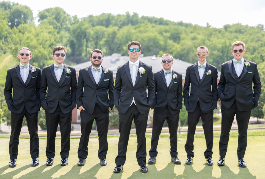 Groom with his guys in suits and sunglasses