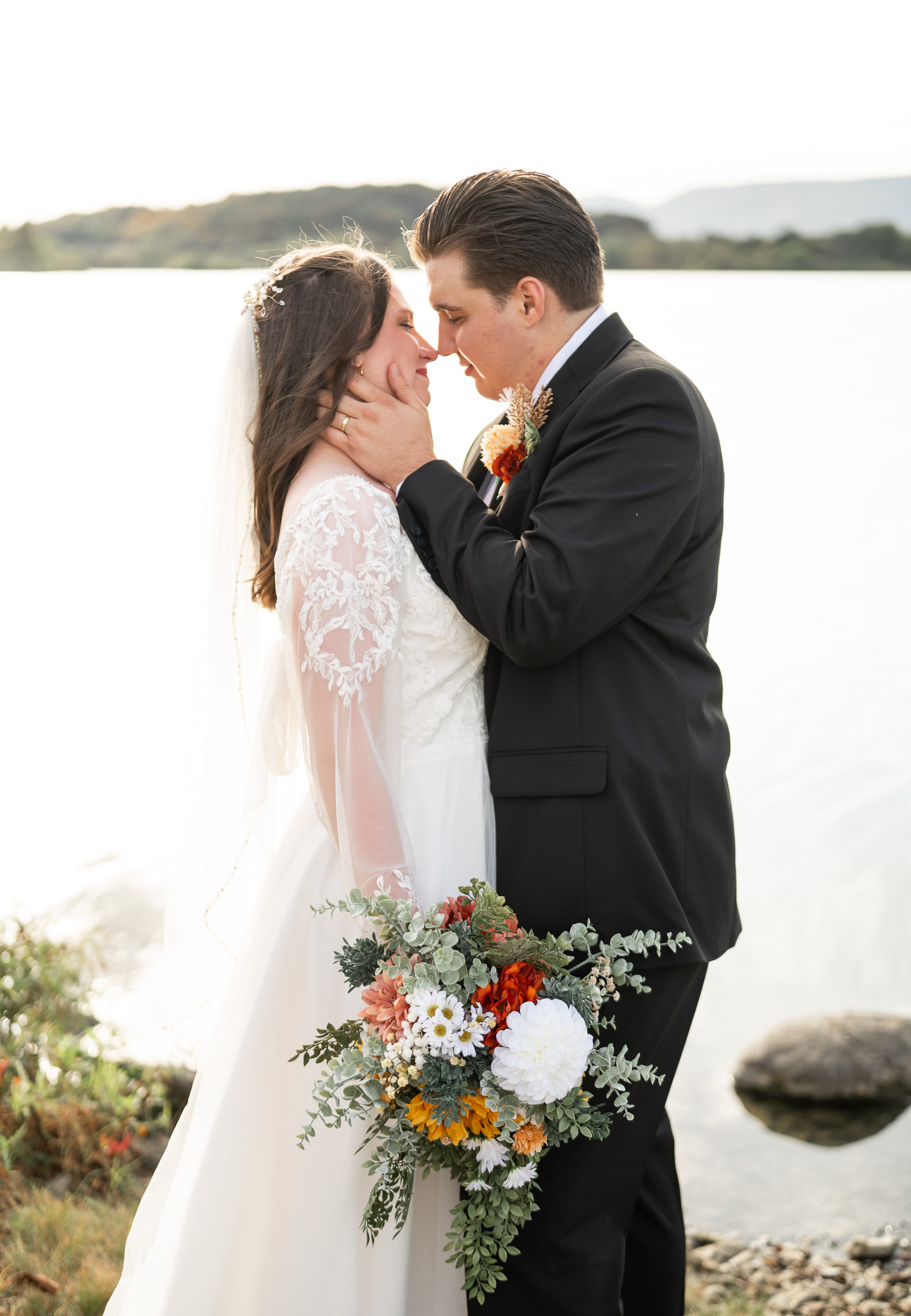 Romantic wedding couple standing by the lake in Beaver Springs PA