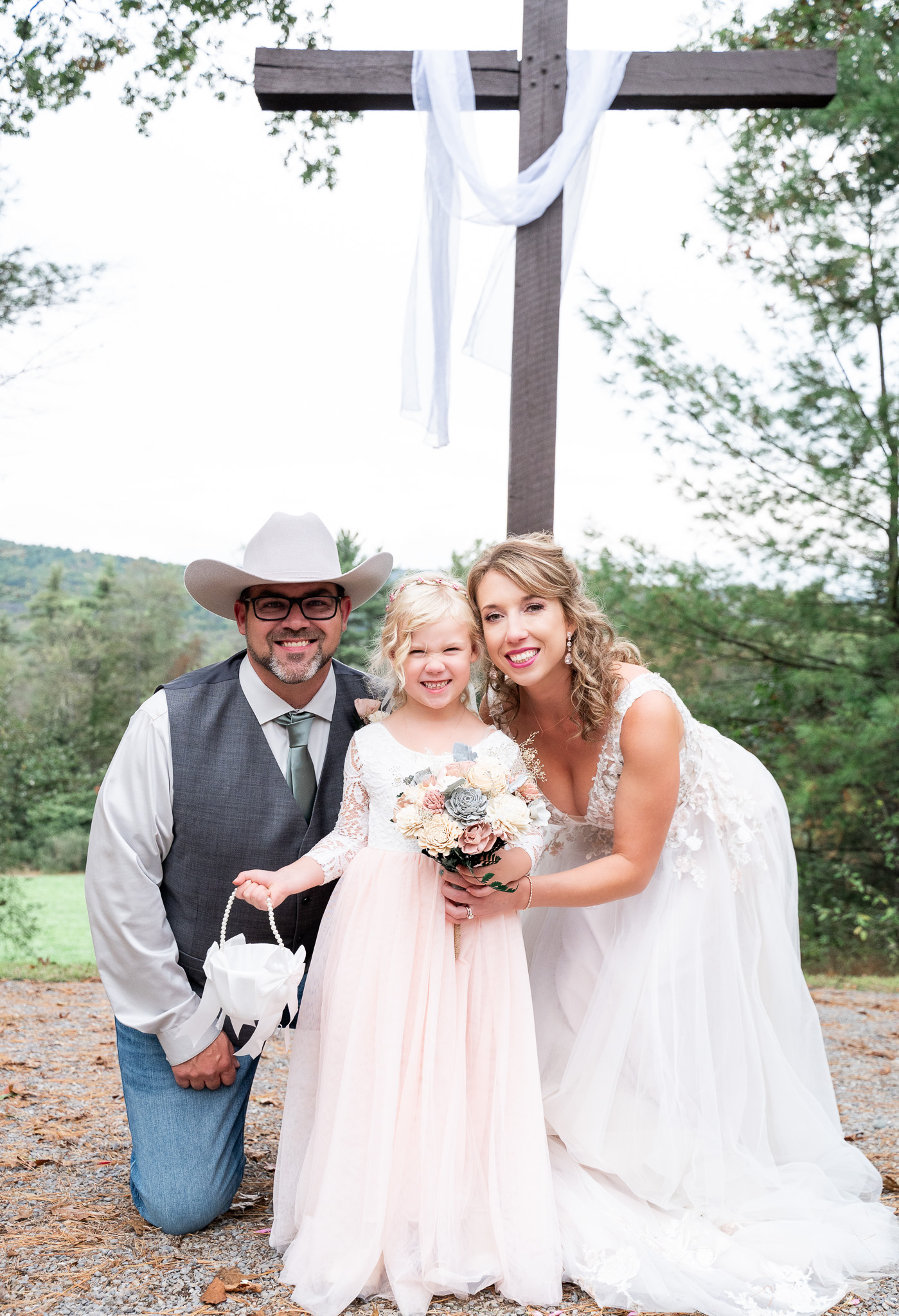 Mom, Dad, and daughter after wedding ceremony