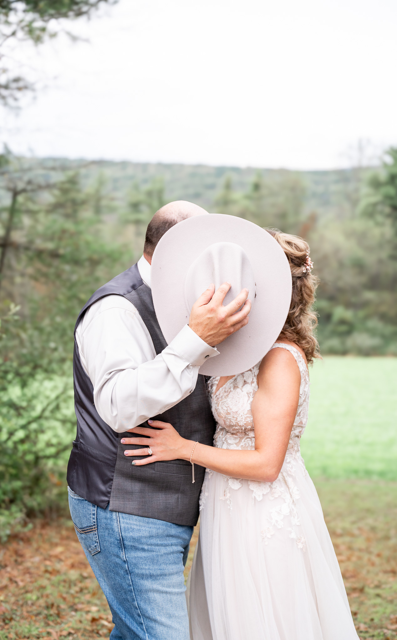 kissing behind hat after wedding in PA