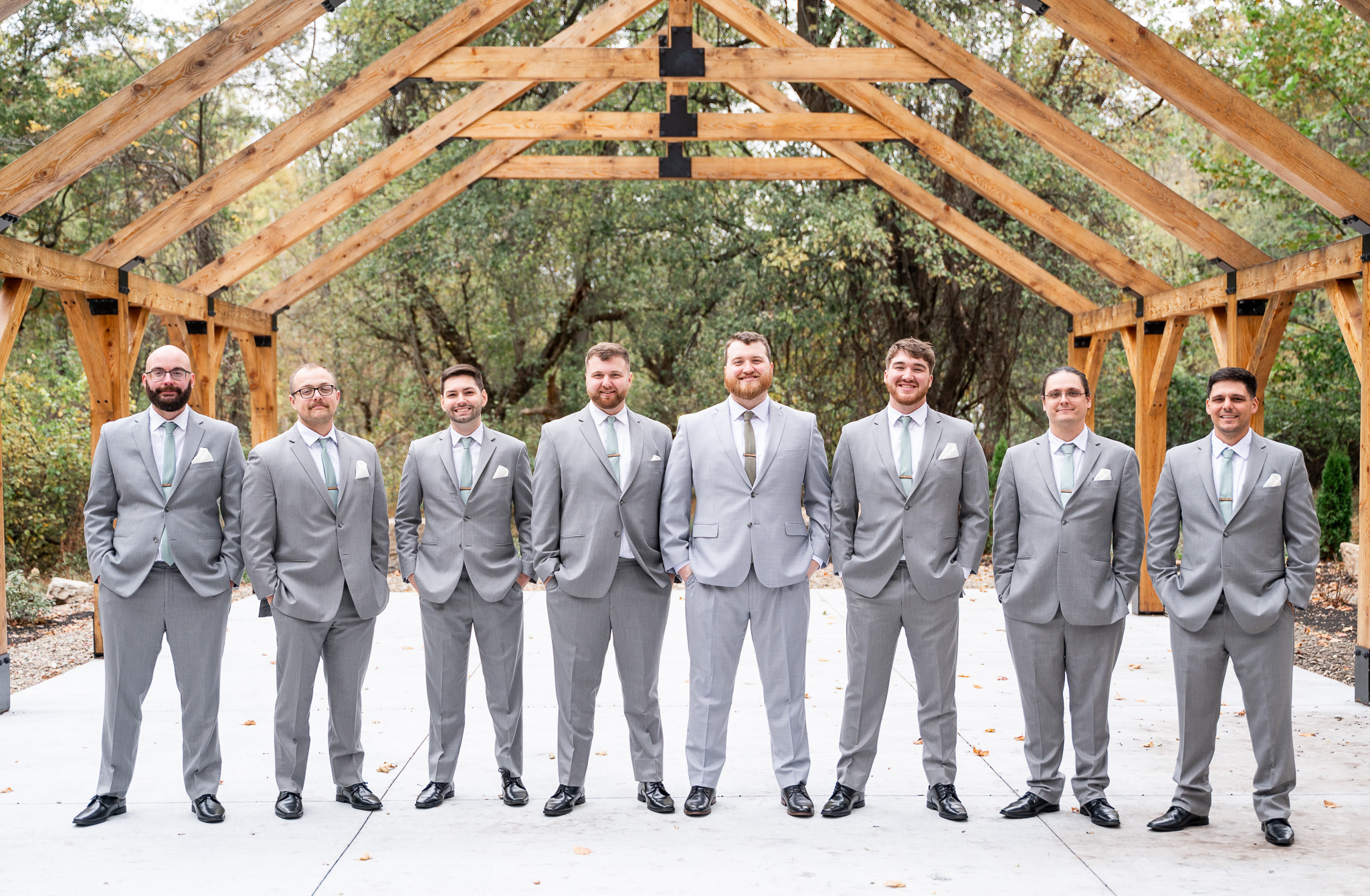 Groomsmen smiling together before the wedding at River Bend Wedding Venue in Central PA